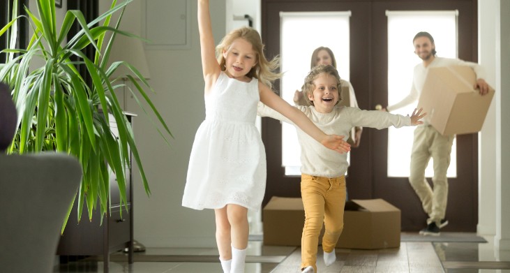 A young family excited as they move into their new home.